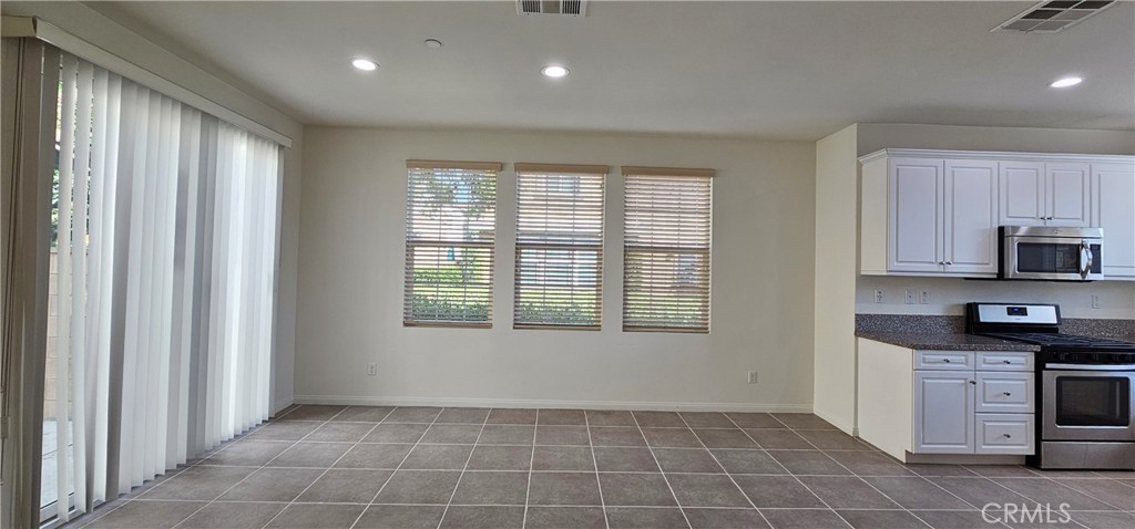8652 Cava Drive Rancho Cucamonga, CA 91730 - Photo 10 of 44 a view of a kitchen with an empty space and a window
