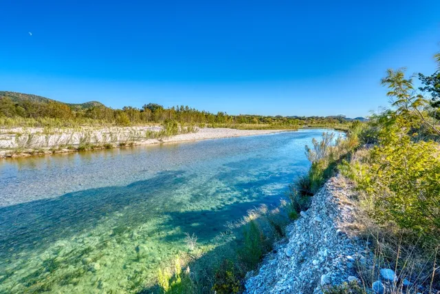 a view of a lake with a mountain in the background