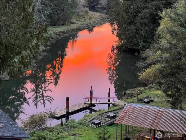 a view of a lake with a yard