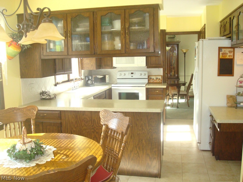 4626 Christman Road Green, OH 44319 - Photo 5 of 22 Fully appliaced kitchen with two pantries, ceramic floor and planning desk