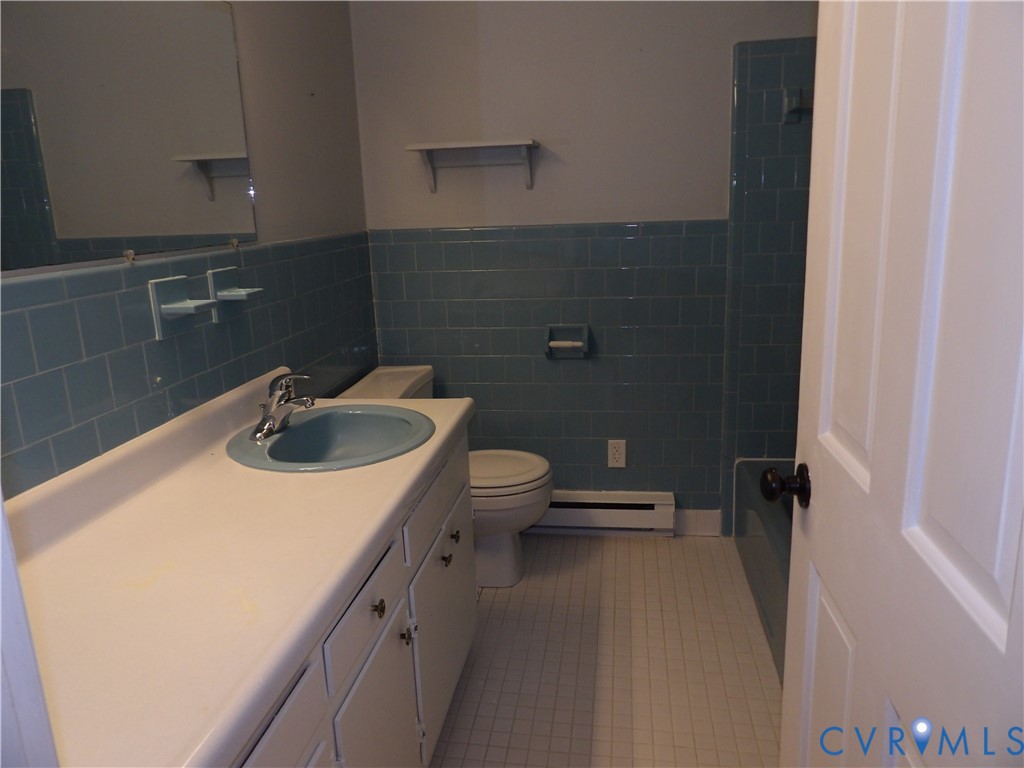 3813 Johnson Road Petersburg, VA 23805 - Photo 39 of 51 White vanity with integrated countertop and blue b