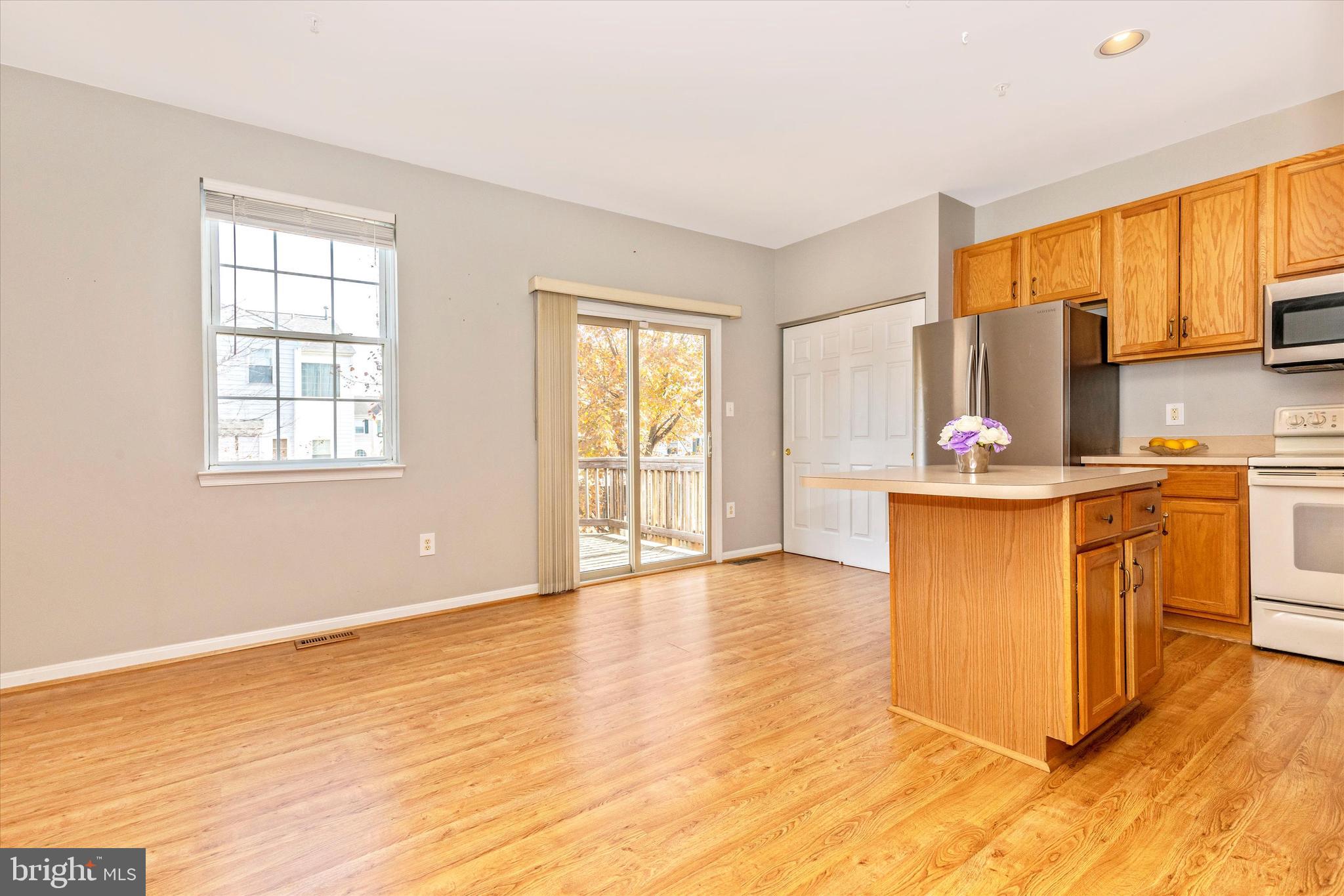 1520 Rambling Way North Frederick, MD 21701 - Photo 17 of 48 Kitchen with island and patio doors to deck