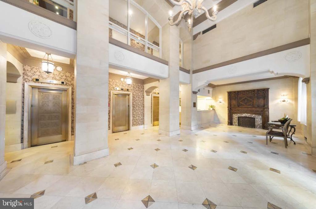 222 West Rittenhouse Square, Unit 404 Philadelphia, PA 19103 - Photo 8 of 29 a view of a hallway with furniture and a chandelier