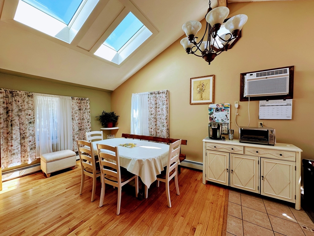 4 Mersea Street Saugus, MA 01906 - Photo 12 of 28 a view of a dining room with furniture window and wooden floor