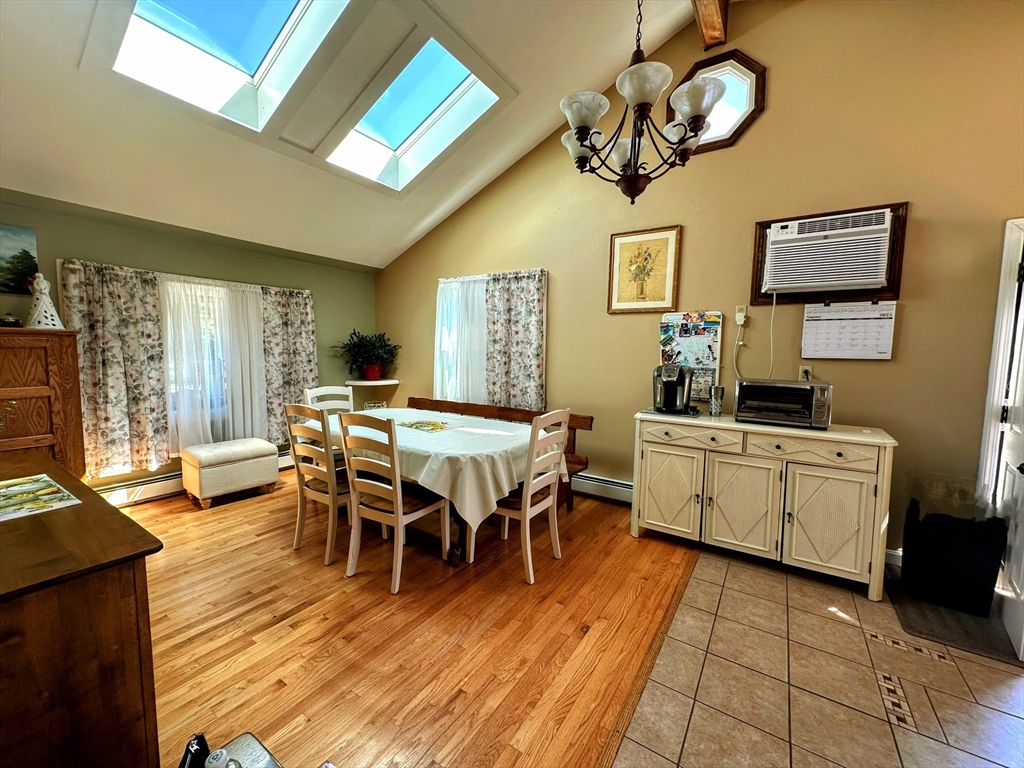 4 Mersea Street Saugus, MA 01906 - Photo 14 of 28 a view of a dining room with furniture a chandelier and wooden floor