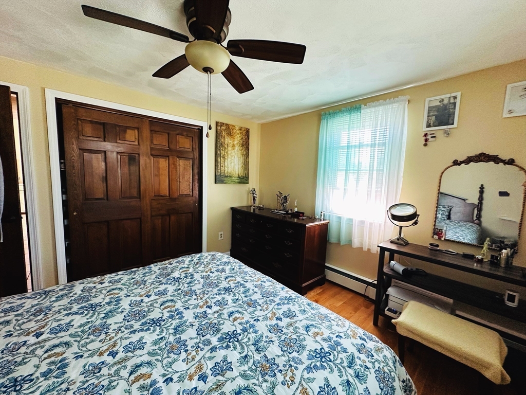 4 Mersea Street Saugus, MA 01906 - Photo 18 of 28 a bedroom with a bed and a dresser