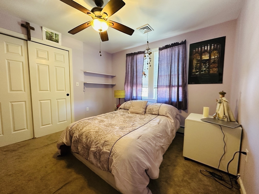 4 Mersea Street Saugus, MA 01906 - Photo 21 of 28 a bedroom with a bed dresser and a window
