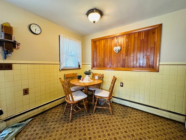 a view of a room with furniture and window