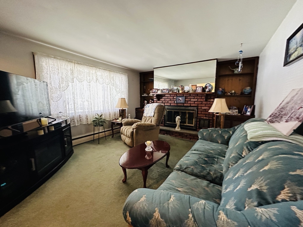 4 Mersea Street Saugus, MA 01906 - Photo 25 of 28 a living room with furniture and a flat screen tv