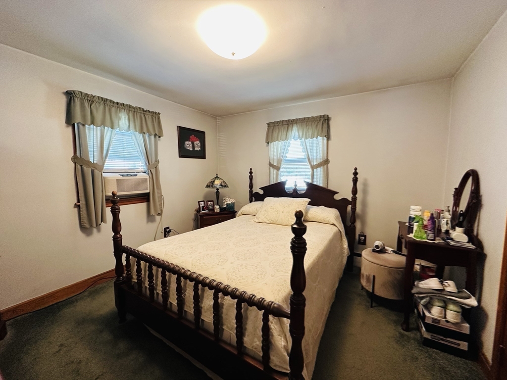 4 Mersea Street Saugus, MA 01906 - Photo 27 of 28 a bedroom with a bed and a dresser