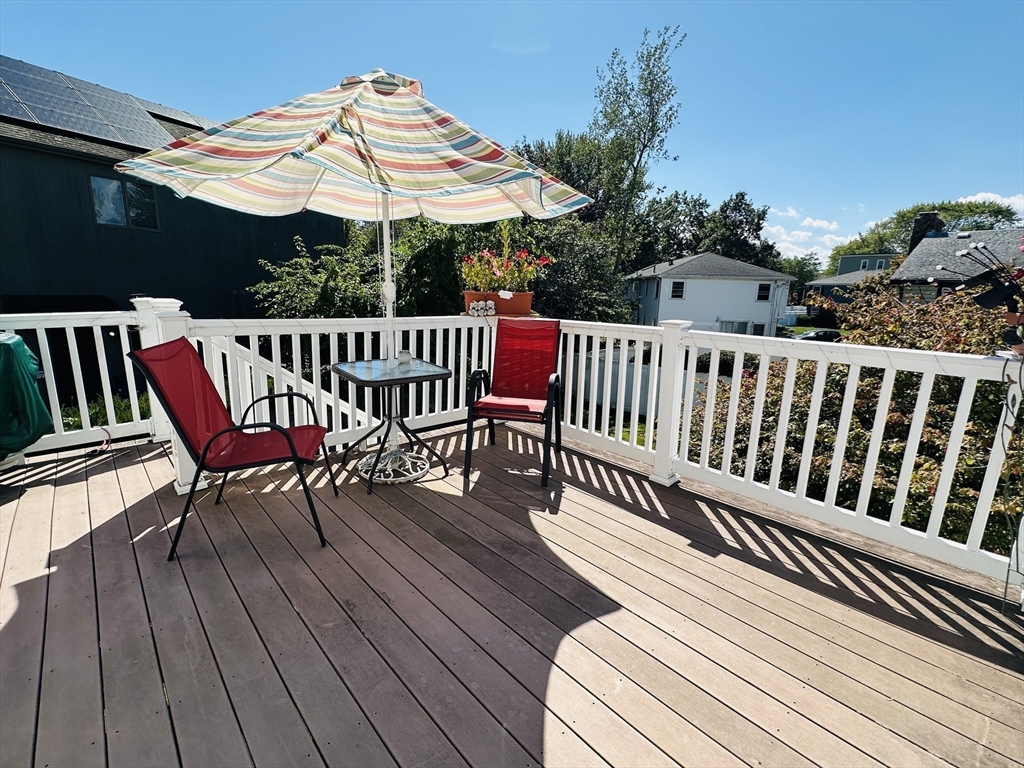 4 Mersea Street Saugus, MA 01906 - Photo 4 of 28 a view of a roof deck with a table and chairs