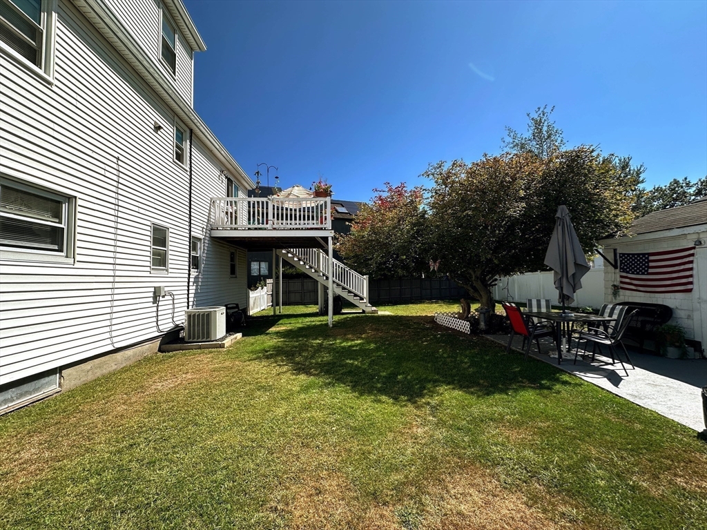 4 Mersea Street Saugus, MA 01906 - Photo 8 of 28 a view of a house with backyard and sitting area