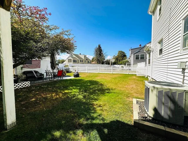 a view of a swimming pool with an outdoor space and seating area