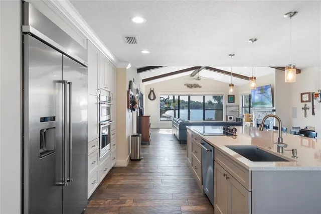 a spacious bathroom with a double vanity sink a mirror and a bathtub