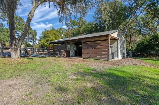 a view of a dining room with furniture and window