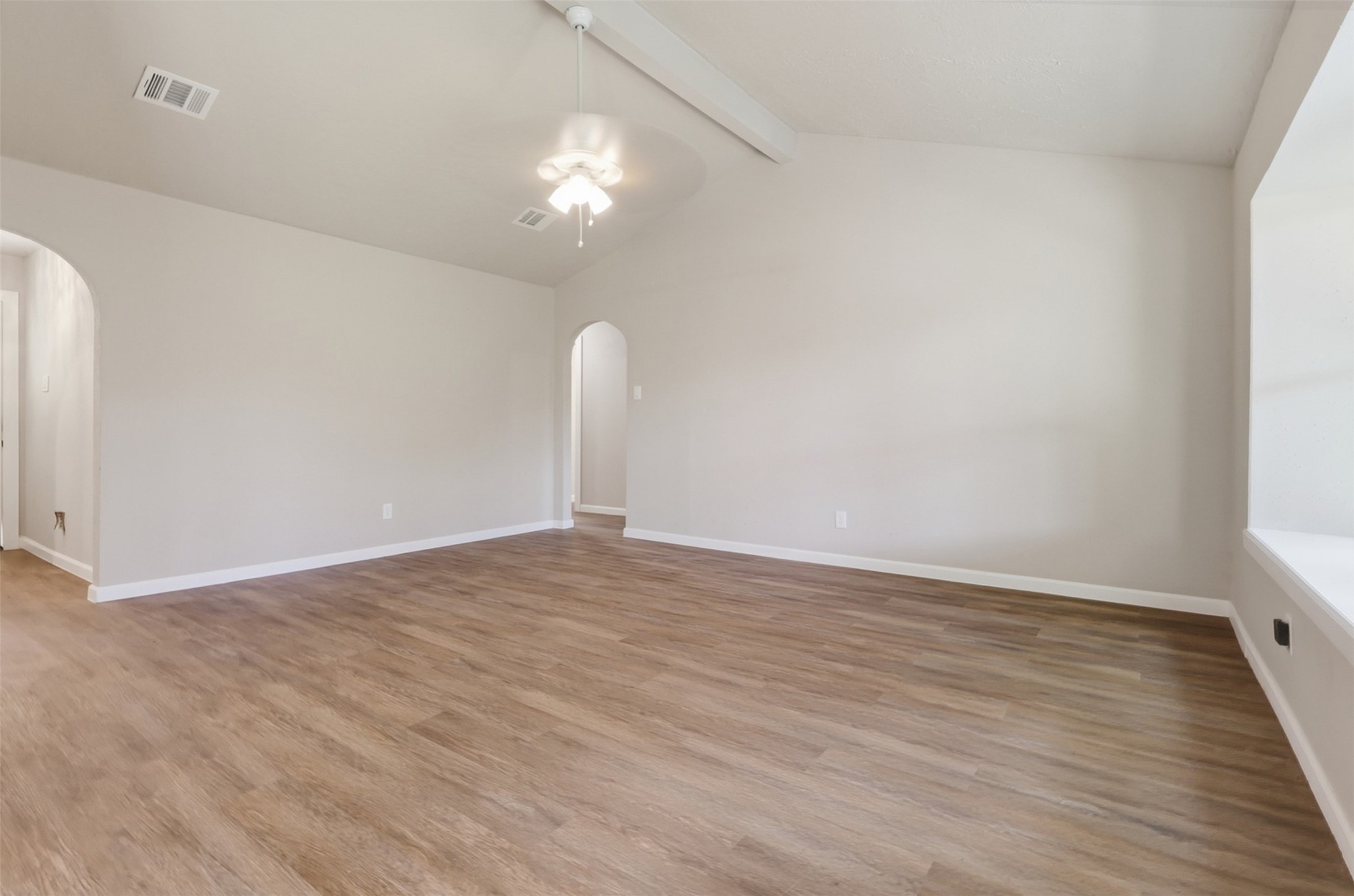 4767 Beechaven Street Houston, TX 77053 - Photo 19 of 26 a view of an empty room with wooden floor and a window