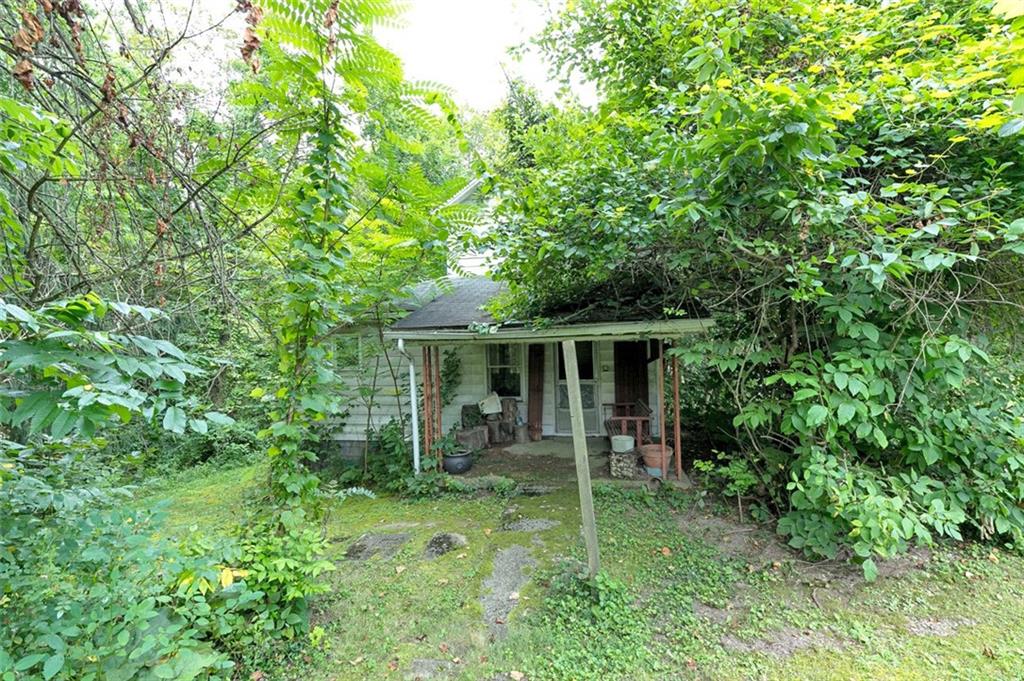 354 Wickhaven Road Wickhaven, PA 15492 - Photo 14 of 19 a backyard of a house with seating space