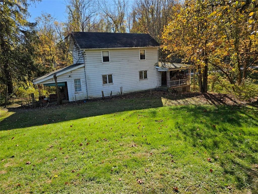 354 Wickhaven Road Wickhaven, PA 15492 - Photo 19 of 19 a view of a backyard with a large tree