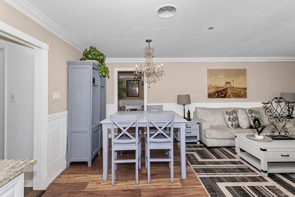 1124 Lakewood Avenue Modesto, CA 95355 - Photo 14 of 40 a living room with furniture a chandelier and a rug