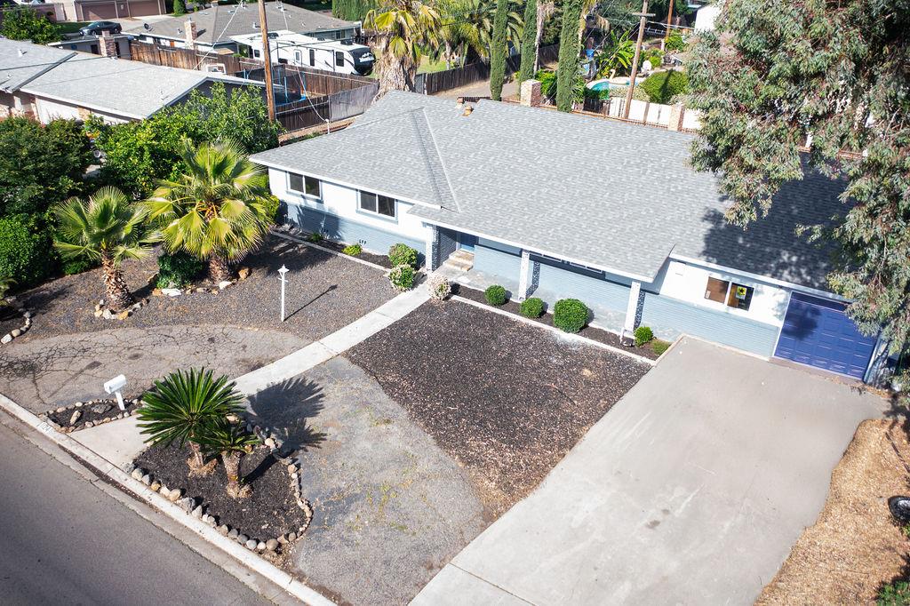 1124 Lakewood Avenue Modesto, CA 95355 - Photo 2 of 40 an aerial view of a house with a yard and potted plants