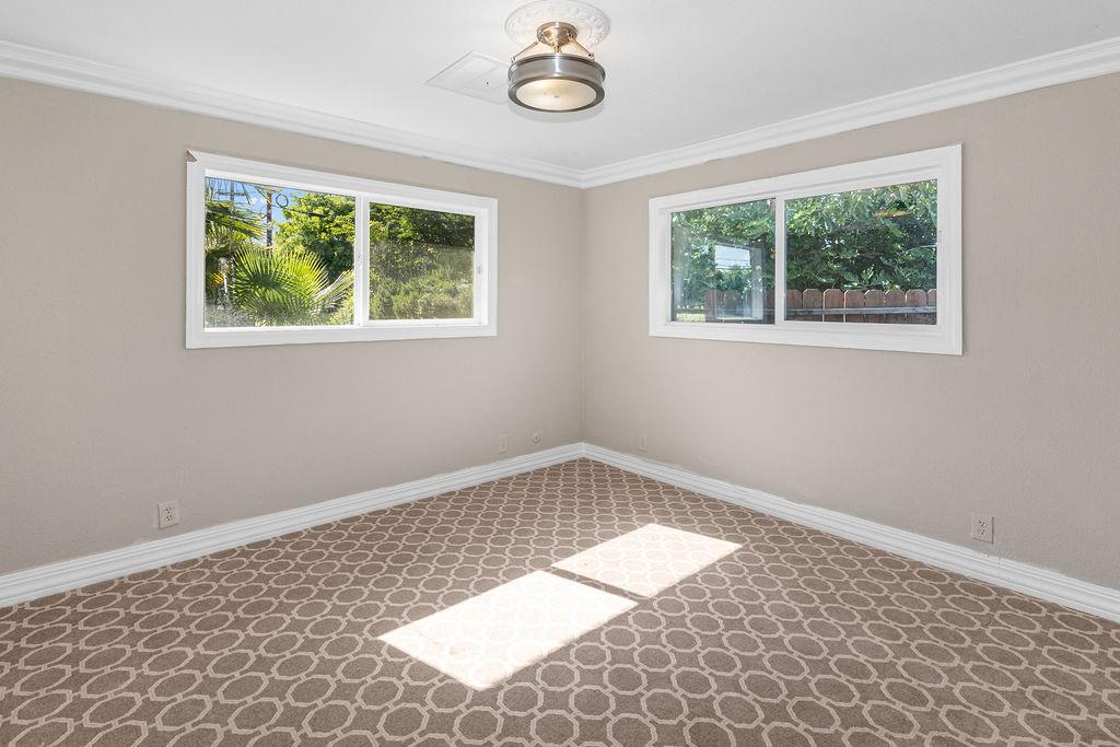 1124 Lakewood Avenue Modesto, CA 95355 - Photo 25 of 40 a view of an empty room with a window