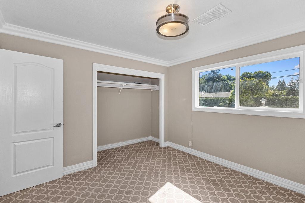1124 Lakewood Avenue Modesto, CA 95355 - Photo 28 of 40 a view of an empty room with a window