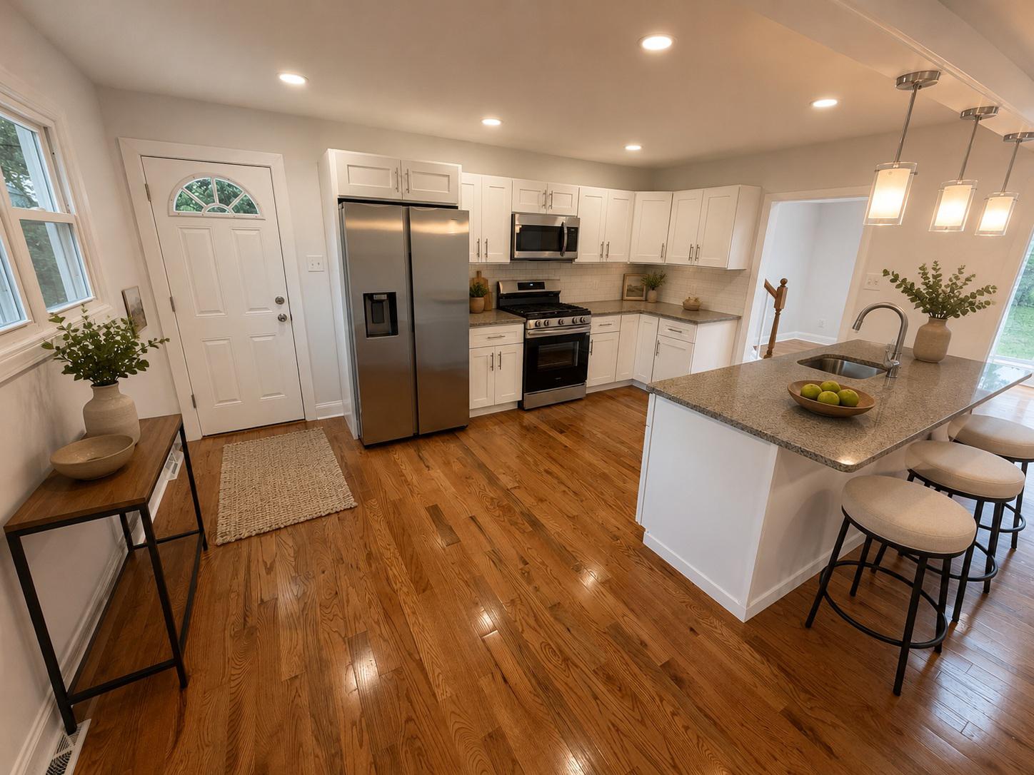 1104 Church Road Wyncote, PA 19095 - Photo 11 of 31 a kitchen with stainless steel appliances granite countertop a refrigerator a stove top oven a sink dishwasher and wooden floor