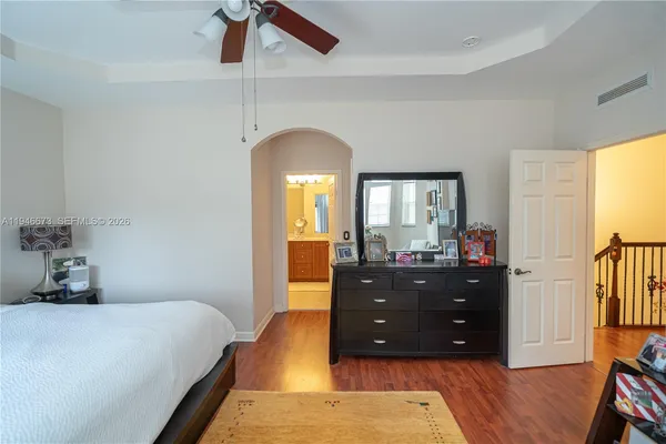 a view of room with walk in closet and cabinet