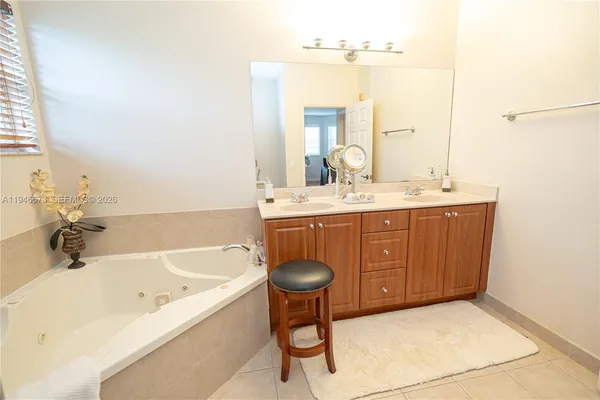 a spacious bathroom with a tub shower and toilet