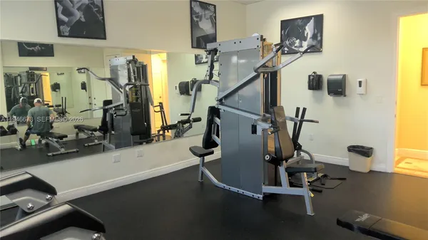 a workspace room with furniture and a window
