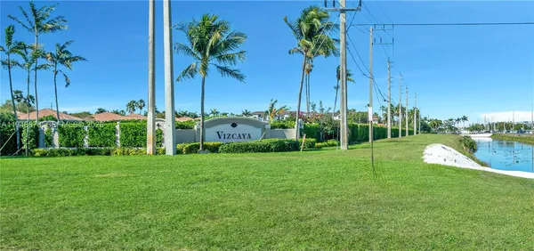 a view of road with palm trees