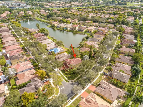 an aerial view of residential houses with outdoor space