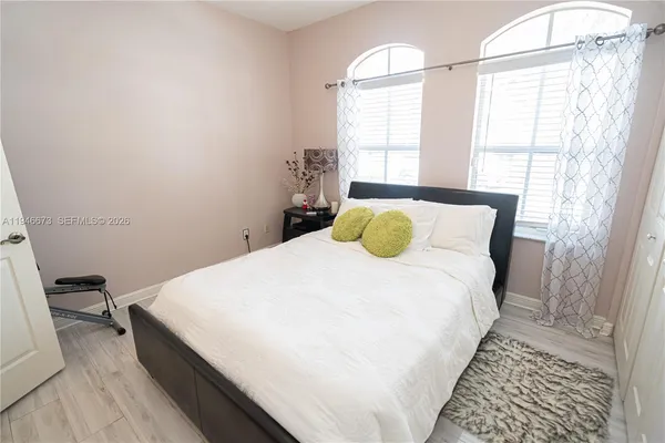 a bedroom with a bed and a television