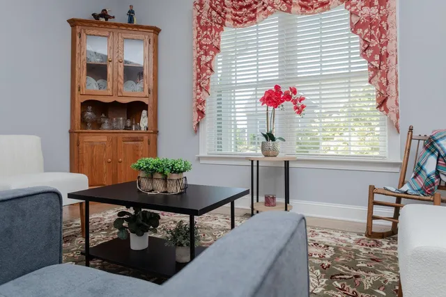 a bathroom with a granite countertop sink and a black white checkered floor