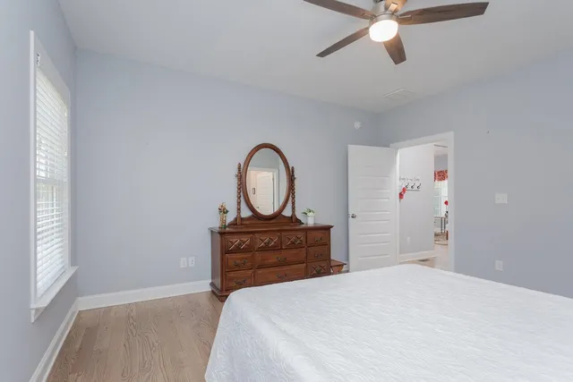 a bedroom with a bed and a view of bathroom