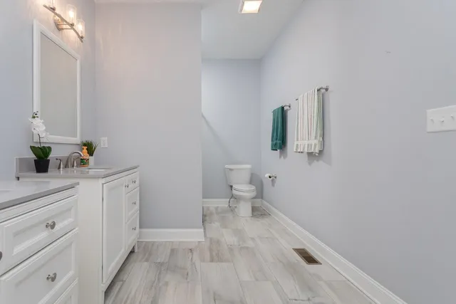 a bedroom with a large bed and the window