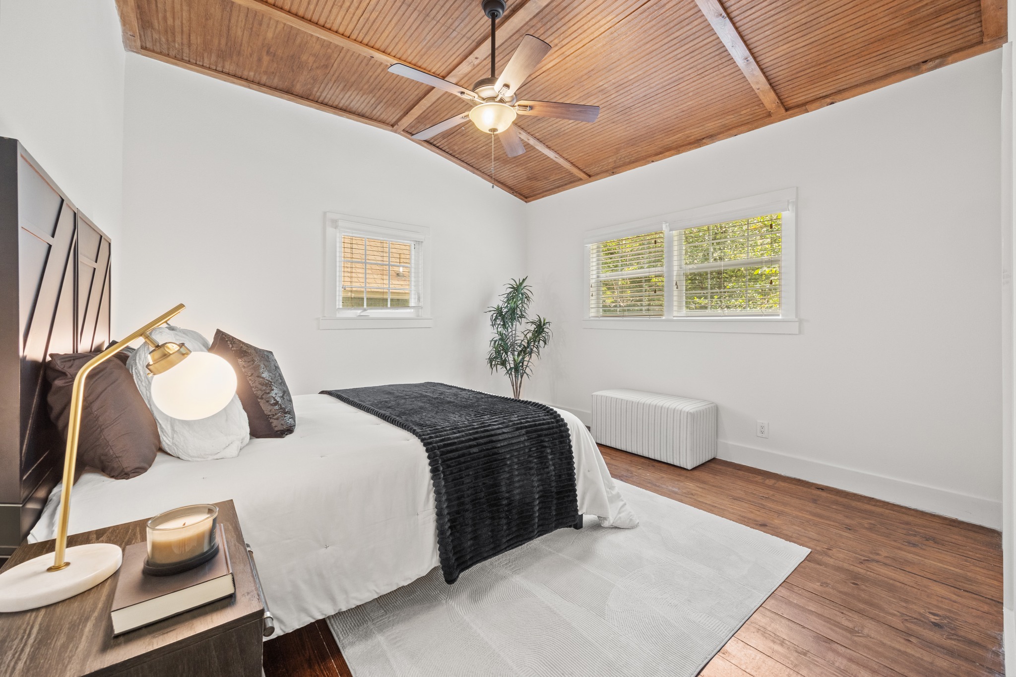 2503 Bryan Street Austin, TX 78702 - Photo 15 of 33 The primary bedroom stands out with high ceilings and tongue-and-groove wood detailing that adds a sense of height to the room
