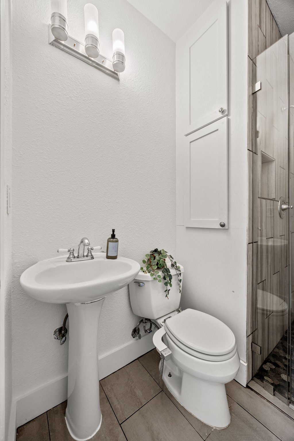 2503 Bryan Street Austin, TX 78702 - Photo 21 of 33 Built-in cabinets set into the wall in the guest bathroom offer a smart way to keep essentials organized