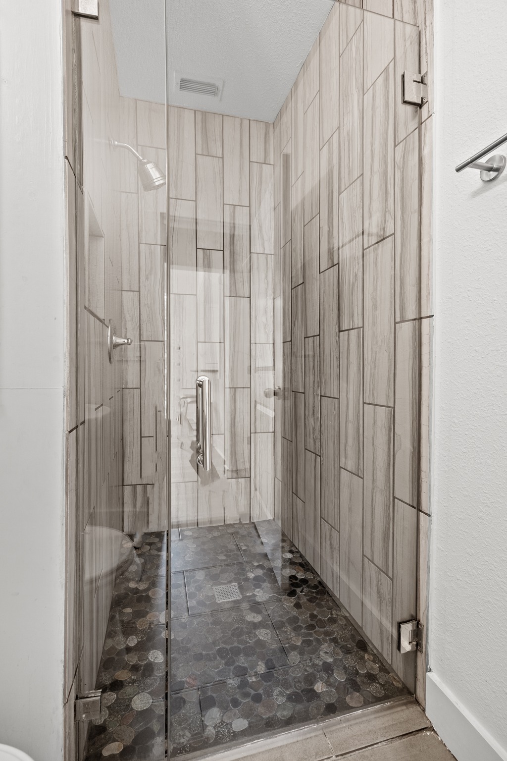 2503 Bryan Street Austin, TX 78702 - Photo 22 of 33 The second bathroom is easily accessible for guests and features a walk-in shower with updated tile work