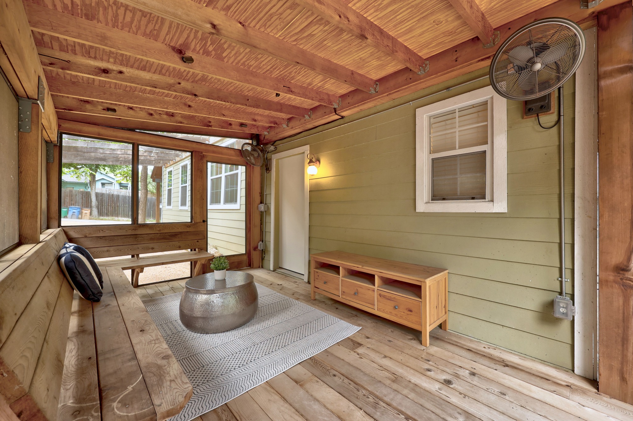 2503 Bryan Street Austin, TX 78702 - Photo 26 of 33 Built-in bench seating runs along the edge of the deck, making it an easy spot for entertaining without needing extra furniture