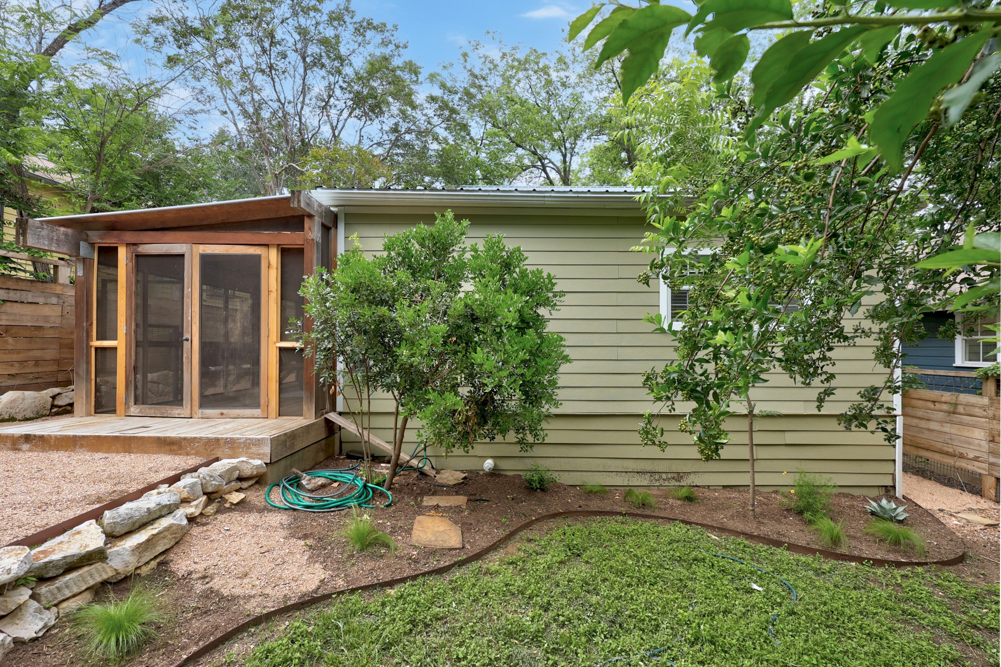 2503 Bryan Street Austin, TX 78702 - Photo 27 of 33 Step down from the screened deck into the beautiful backyard