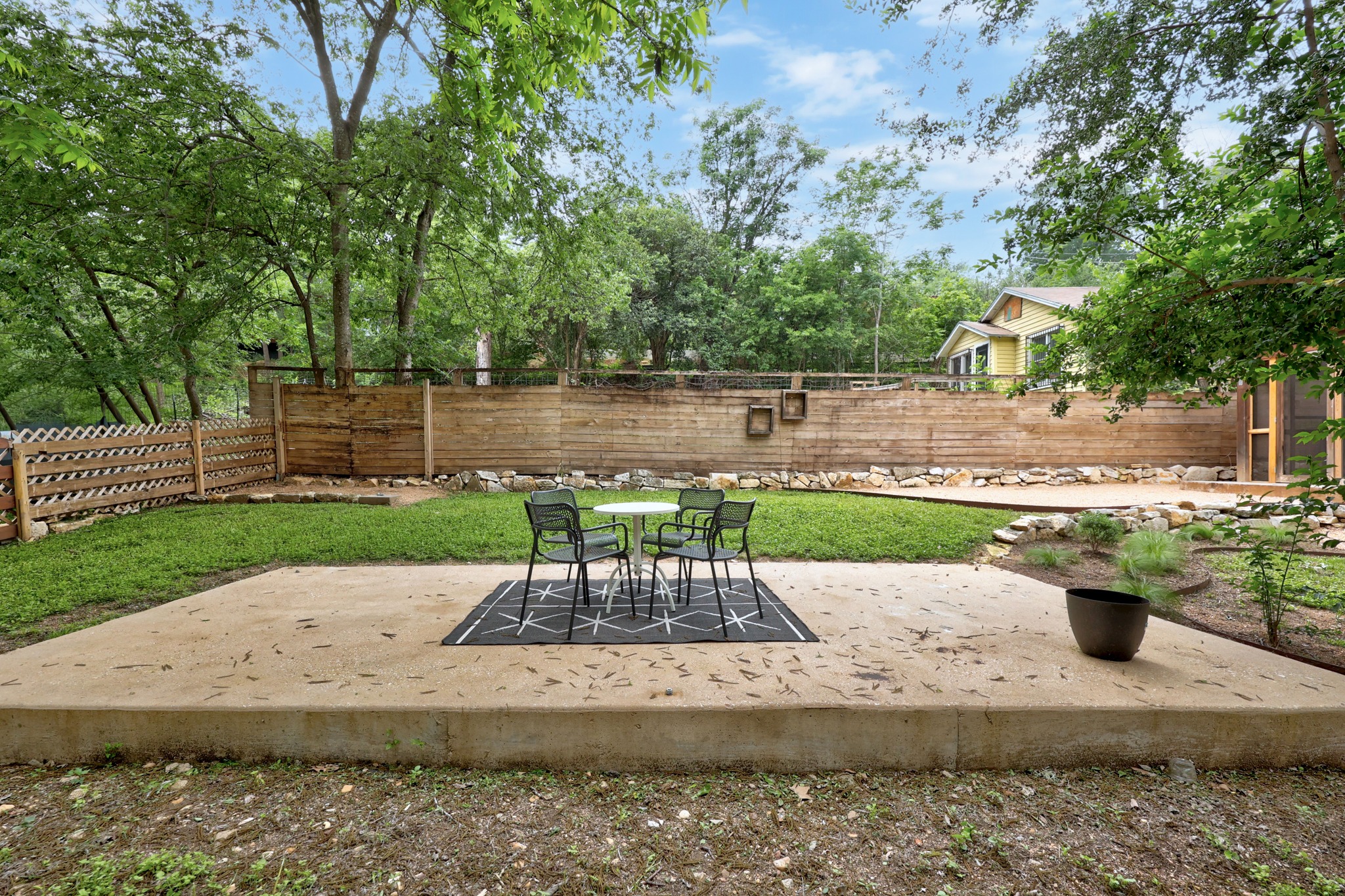 2503 Bryan Street Austin, TX 78702 - Photo 30 of 33 The backyard is wrapped in trees and a private fence, giving you a sense of seclusion despite being so close to downtown