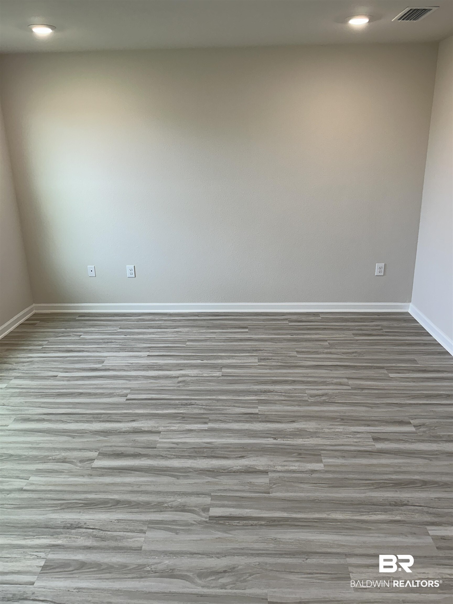 8850 Sea Star Circle Foley, AL 36535 - Photo 16 of 29 Unfurnished room featuring light hardwood / wood-style flooring