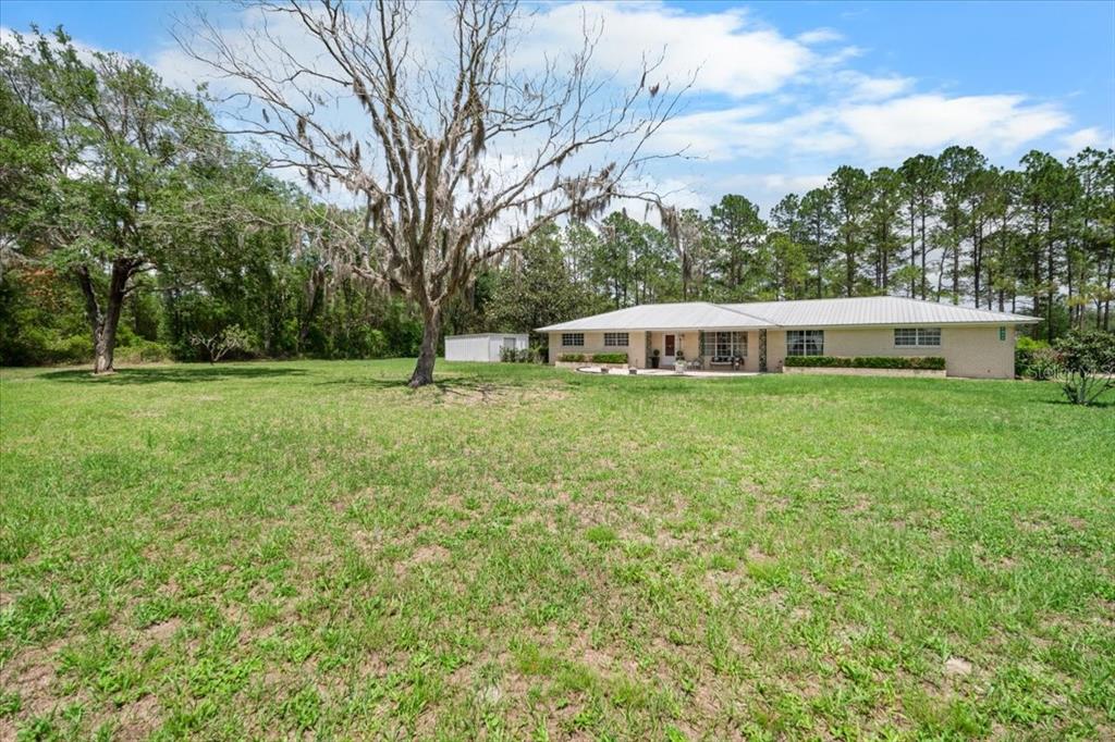 7422 County Road 231 Lake Butler, FL 32054 - Photo 2 of 57 a view of a house with a big yard
