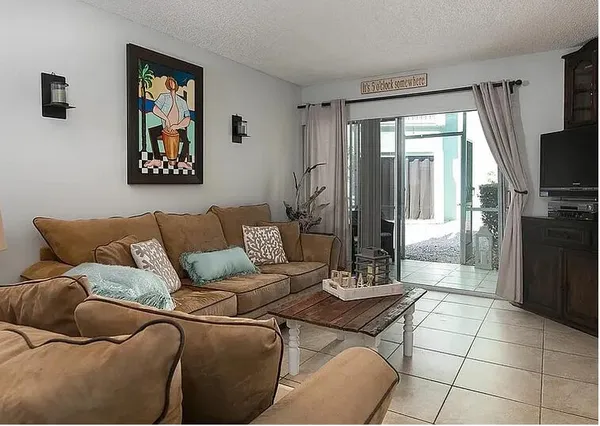 a living room with a couch and a flat screen tv