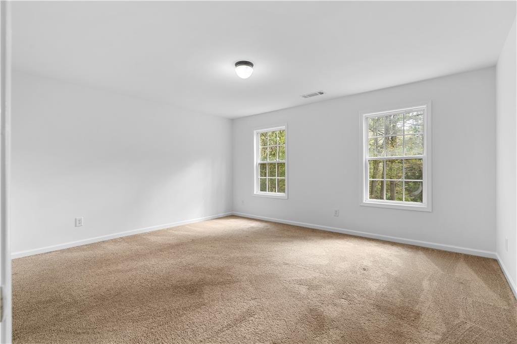 80 Castle Court Ellijay, GA 30540 - Photo 11 of 31 an empty room with windows