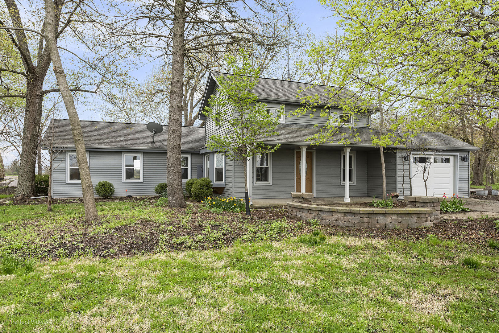 2580 Van Dyke Road Minooka, IL 60447 - Photo 1 of 32 a front view of a house with garden
