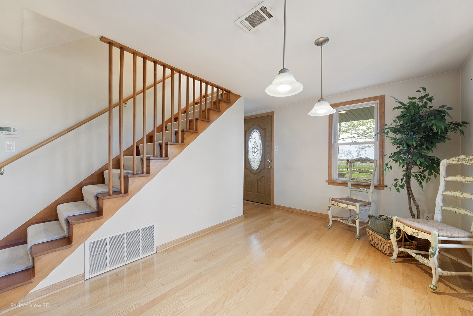 2580 Van Dyke Road Minooka, IL 60447 - Photo 15 of 32 a view of entryway and hall with wooden floor