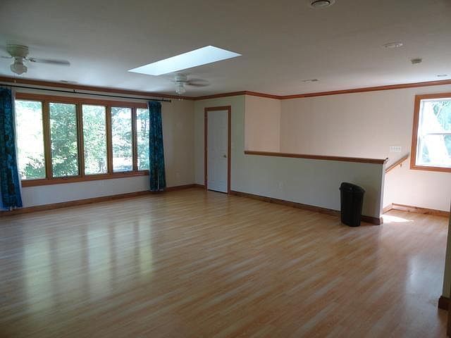 2580 Van Dyke Road Minooka, IL 60447 - Photo 25 of 32 an empty room with wooden floor and windows