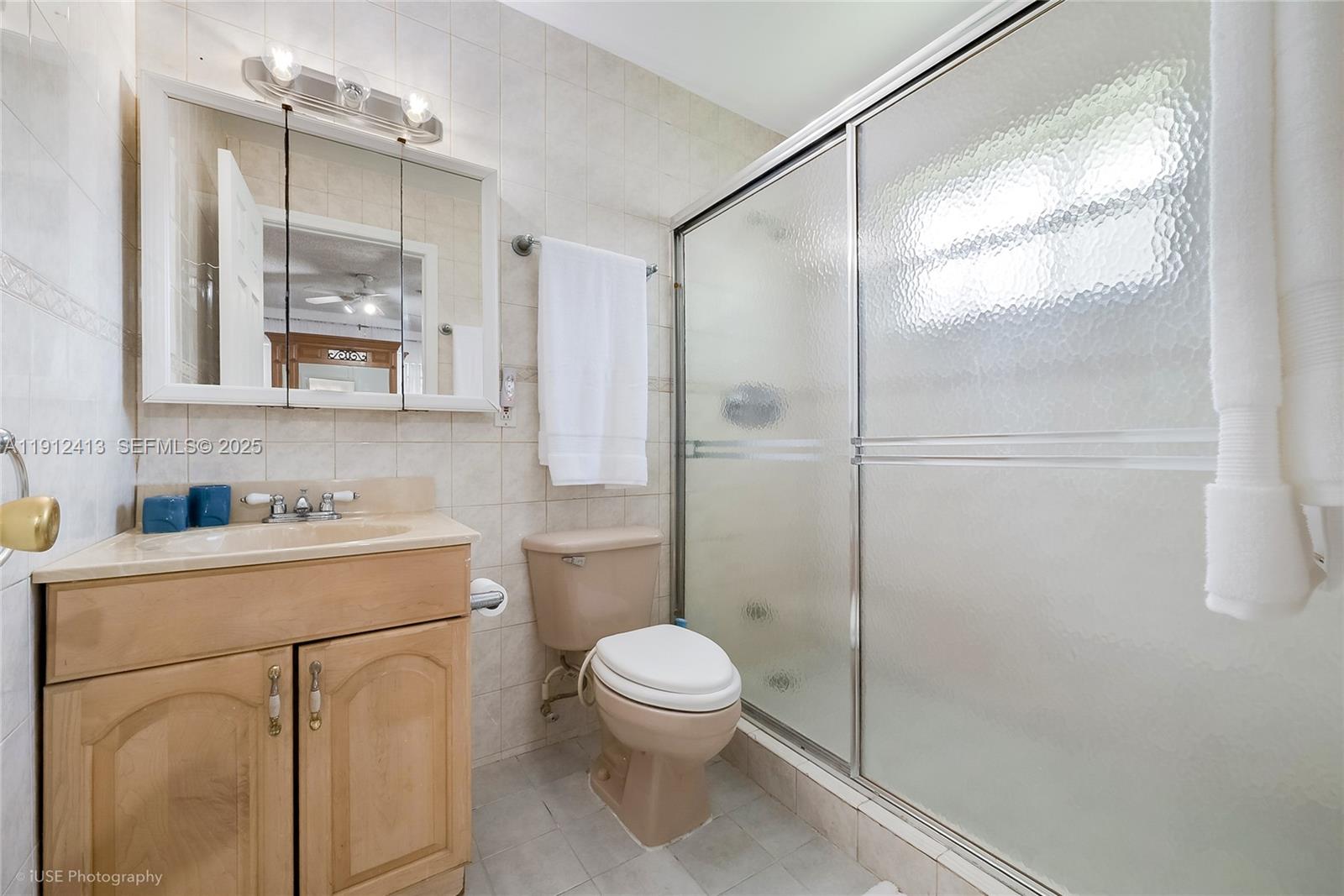 4235 Southwest 97th Avenue Miami, FL 33165 - Photo 12 of 21 a bathroom with a granite countertop sink toilet a mirror and shower
